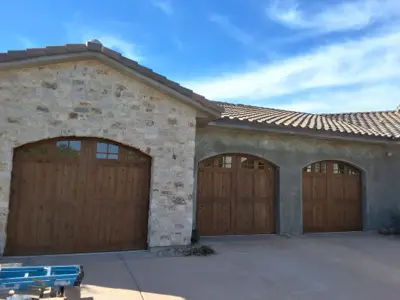 Custom Wood Arched Garage Door Installation with Smart Opener