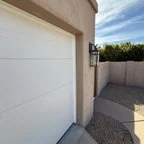 After - 18x7 Garage Door Panel Replacement with Steel Flush Door