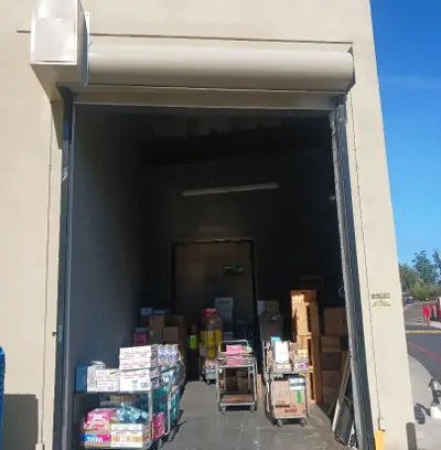 Before — Commercial Roll-Up Door Repair After Delivery Truck Impact