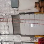 After - Commercial Garage Door Repair for Industrial Facility Vertical Sectional Doors