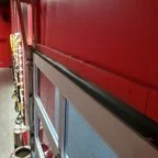 After - Commercial Glass Garage Door Installation for Fitness Facility