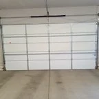 After - Stamped Carriage House Garage Door Panel Replacement