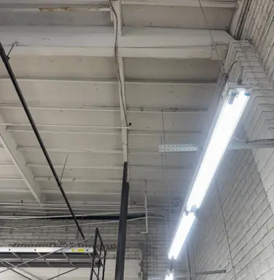 Before — Commercial Garage Door System Removal for Roof Repair Project