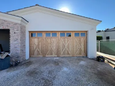 After — Custom Wood Garage Doors with Smart Opener Installation
