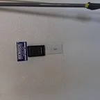 After - Insulated Garage Door Replacement with Modern Almond Raised Panel Design