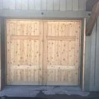 After - Custom Cedar Wood Garage Door Installation for New Build
