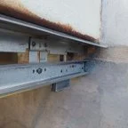 After - Commercial Garage Door Repair for Industrial Facility Vertical Sectional Doors