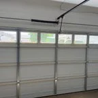 After - 16x7 Garage Door Replacement with Glass Top Panel