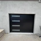 After - Commercial Garage Door Installation: Two Modern Steel Doors for Valwest Construction