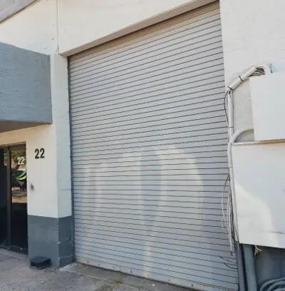 Commercial Garage Door Repair for EverLine Coatings - Damaged Door Components