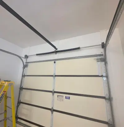 Wood Garage Door Panel Repair and Track Realignment