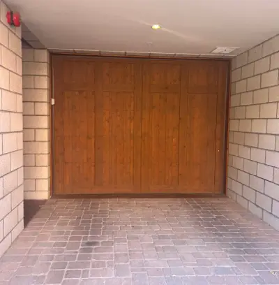 Custom Wood Overlay Garage Door Installation with Smart Opener