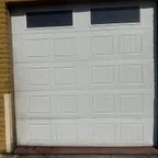 Before - Commercial Overhead Sectional Door Replacement for Auto Service Facility