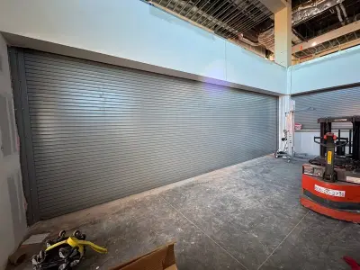 Commercial roll-up door installation in progress