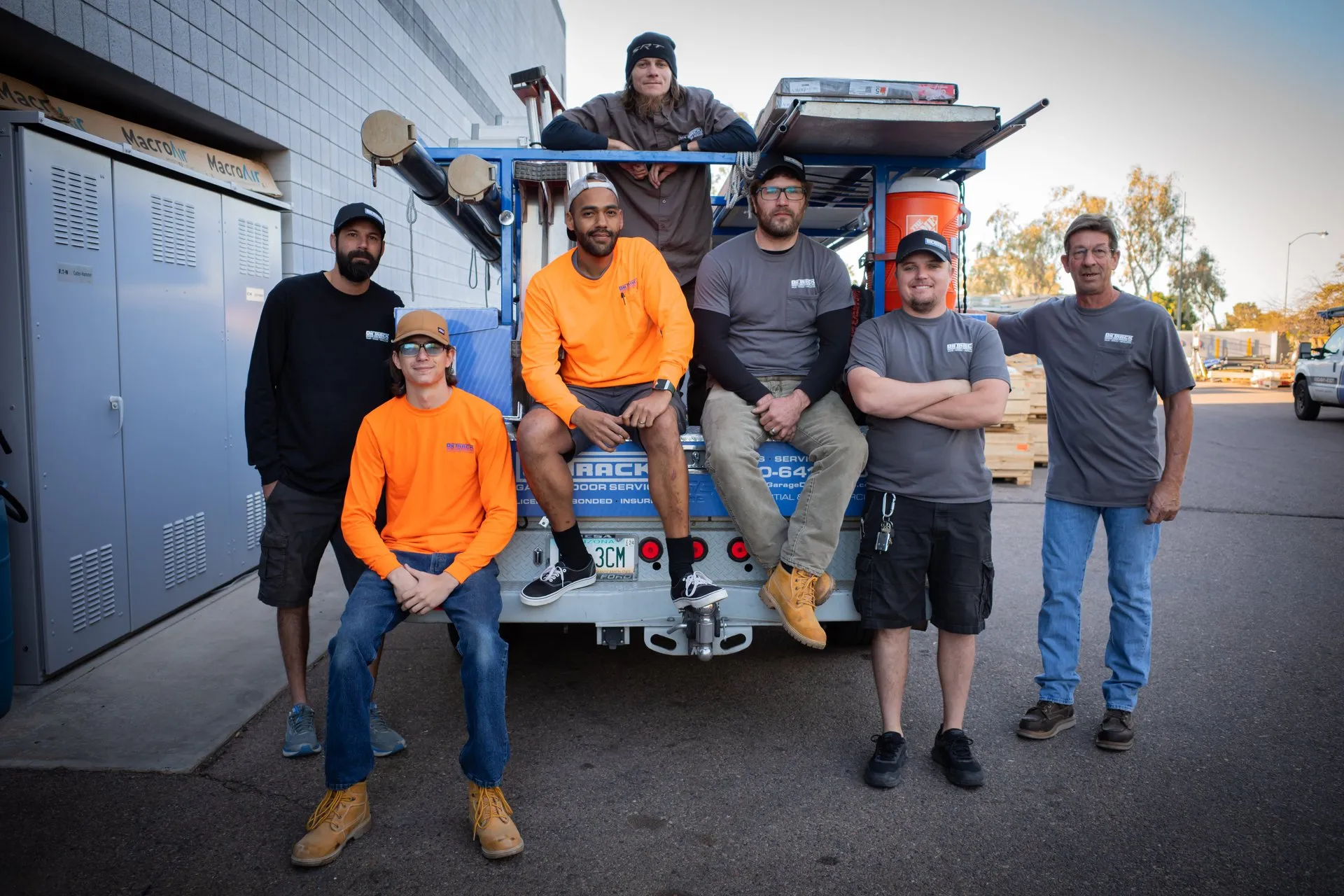 On Track team with service truck and garage door parts
